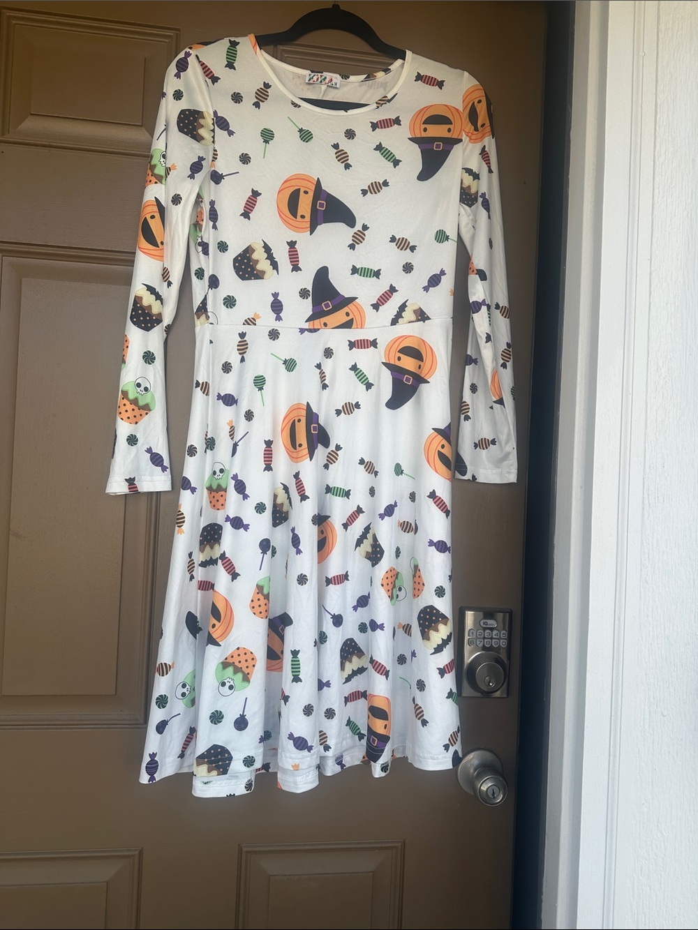 “Kira” Women’s White Halloween Pumpkin & Candy Print Skater Dress